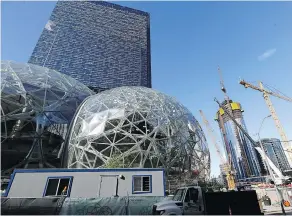  ?? ELAINE THOMPSON / THE ASSOCIATED PRESS FILES ?? The Amazon building in Seattle is seen in the background in 2017, but the question now is where will the company’s second headquarte­rs be?