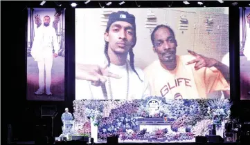  ?? — AFP ?? Snoop Dogg speaks onstage during Hussle’s Celebratio­n of Life at Staples Center on Thursday in Los Angeles, California.