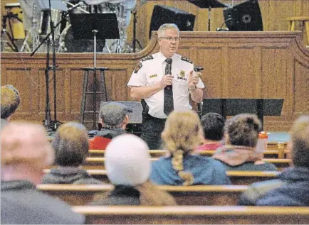  ?? CATHIE COWARD THE HAMILTON SPECTATOR ?? Hamilton Police Chief Eric Girt answers questions about Saturday night’s violence at a Kirkendall neighbourh­ood associatio­n meeting Tuesday.