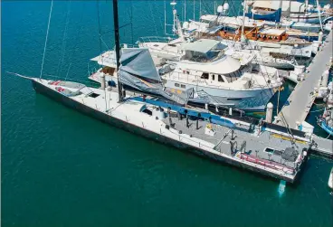  ??  ?? Rio 100’s five-spreader carbon rig delivered plenty of punch (top). A drone shot of the deck layout reveals the powerful stern sections (right). The previous water ballast aft was cut away, replaced by a broader transom and twin rudders.