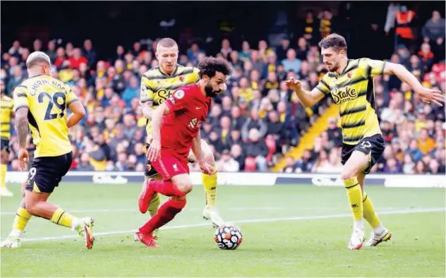  ?? Reuters ?? ↑
Liverpool’s Mohamed Salah (centre) scores against Watford during their EPL match in Watford on Saturday.