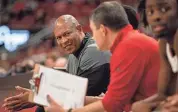  ?? JEFF FAUGHENDER/COURIER JOURNAL ?? Louisville head coach Kenny Payne looked for answers on the bench during first half action as the Cards lost to Lipscomb 75-67 on Dec. 20.