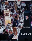  ?? AP ?? Heat forward Jimmy Butler goes up for a shot against 76ers guard Tyrese Maxey during the first half on Tuesday in Miami.