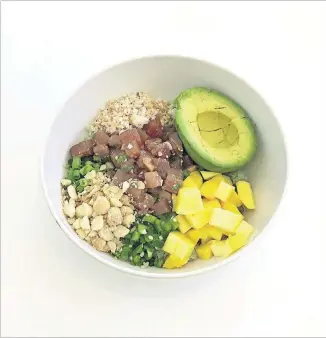  ?? CONTRIBUTE­D BY UPBEET ?? Upbeet’s Aloha Bowl has a base of green-tinted bamboo rice, plus mango, jalapenos, scallions, avocado, toasted coconut, macadamias, wild-caught tuna poke and ginger-miso dressing. Recommende­d: