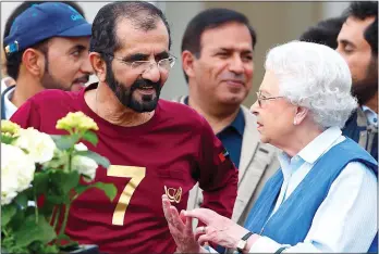  ??  ?? RACING FRIENDS: The Queen with Sheikh Mohammed at the Windsor Horse Show in 2014