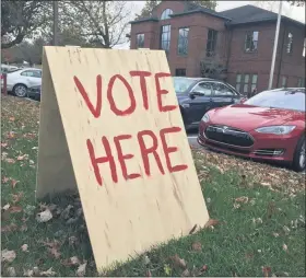  ?? PETE BANNAN — MEDIANEWS GROUP ?? A “Vote Here” sign alerts residents to their East Goshen polling location at the Township building on Paoli Pike.