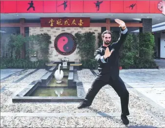  ?? PROVIDED TO CHINA DAILY ?? WWE ‘bad guy’ Colby Daniel Lopez — aka ‘Seth Rollins’ — shows off some kung fu moves at a martial arts club in Shanghai last week. The American was in town to promote the wrestling promotion’s Sept 1 show at Mercedes-Benz Arena.