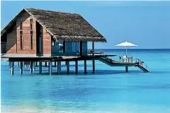  ??  ?? One of the 32 luxurious over-water villas.