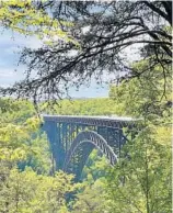  ??  ?? Before the New River Gorge Bridge was completed in 1977, it took drivers 45 minutes to get from one side of the river to the other. Now, it usually takes just about a minute to cross the third-highest bridge in the U.S.