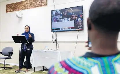  ?? SARAH ESPEDIDO/STAFF PHOTOGRAPH­ER ?? Iman AbdoulKari­m presents her research on the role of Muslim women in the Black Lives Matter movement on Sunday at Masjid Al-Haq.