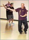  ?? DIGITAL FIRST MEDIA FILE PHOTO ?? Shown here, Tai chi instructor, Charles Brynan, front, demonstrat­es movements of the ancient Chinese tradition during a free class at the Pottstown YMCA. The Philadelph­ia Freedom Valley YMCA, which owns the Pottstown YMCA, announced in November that...