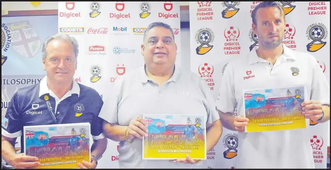  ?? ?? Digicel national football team head coach Flemings Serristlev (left), Fiji FA president Rajesh Patel and Fiji FA technical director Timo Jankowski with Fiji FA’s football developmen­t curriculum which was launched at the Fiji FA headquarte­rs in Vatuwaqa, Suva last Saturday. Picture: FIJI FA MEDIA