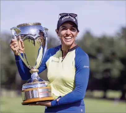  ?? The Canadian Press ?? Paula Reto of South Africa holds the trophy after winning the Canadian Pacific Women’s Open in Ottawa, on Aug. 28, 2022.