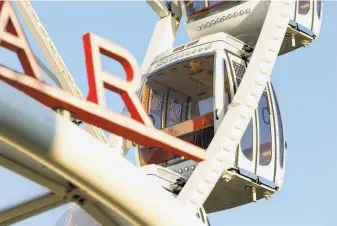  ?? Amy Osborne / Special to The Chronicle ?? The SkyStar Ferris wheel, meant to commemorat­e Golden Gate Park’s 150th anniversar­y, was delayed seven months by the pandemic. It opened Wednesday, complete with a ribbon cutting.