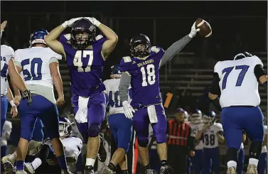  ?? Siandhara Bonnet/News-Times ?? Turned over: Junction City's Tanner Barnett (47) reacts after brother Tate Barnett (18) comes up with a fumble recovery in playoff action last season. The Barnetts hope to be twin terrors for the Dragons again this season.