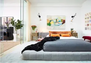  ?? Associated Press ?? ■ A bedroom designed by Jenny Kirschner. A striking work of art can make a room, as shown by this bedroom. It takes a careful touch, but homeowners can consider moving a piece of art they already own from one room to another as a cost-free way of...