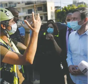  ?? H. MALLA/REUTERS ?? U.S. diplomat David Hale visits the scene of last week’s explosion at the Port of Beirut. The explosion killed at least 172 people and injured 6,000 others.