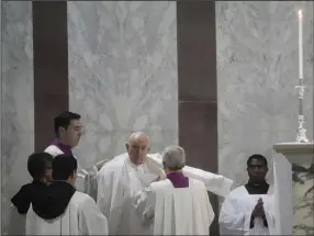  ?? (AP/Gregorio Borgia) ?? Pope Francis (center) arrives at the Basilica of Santa Sabina in Rome where he celebrated Mass on Ash Wednesday, which opens the Lenten season of abstinence and deprivatio­n for Christians before Holy Week and Easter.