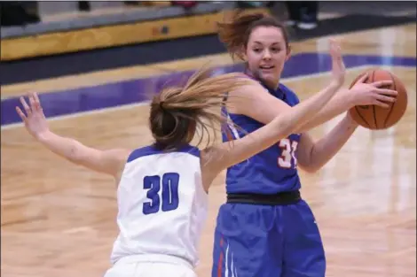  ?? ERIC BONZAR — THE MORNING JOURNAL FILE ?? Bay’s Maeve Johnston looks to move the ball up court past Gilmour defender Athena Hocevar during a Division II Barberton Region semifinal on March 6. With returning players such as Johnston, along with a new coach in former Gilmour coach John Curran, the Rockets are hoping to not only duplicate, but surpass the success of the 2017-18 season.