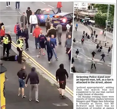  ??  ?? Sickening: Police stand over an injured man, left, as a fan is attacked in the street, above