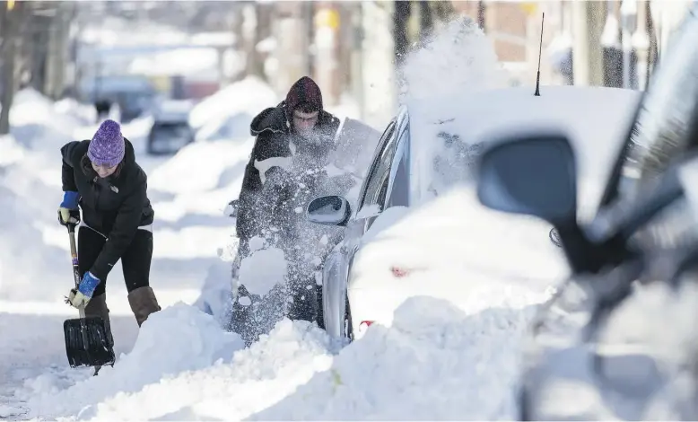  ?? Michael Hawkins / The Cana dian Press ?? The record-breaking 128 centimetre­s of snow that hit Saint John, N.B., this week left a man who owned his own plow, and hired several others as well, unable to get out of his drive.