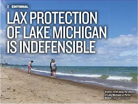  ??  ?? Visitors stroll along the shores of Lake Michigan at Porter Beach.
| SUN- TIMES FILE PHOTO