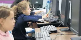  ?? AMY BETH BENNETT/STAFF PHOTOGRAPH­ER ?? Fourth grader Rochel Hodakov works in the computer lab at Hebrew Academy Community School in Margate, which has undergone renovation­s this year.