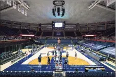  ?? David Butler II / USA TODAY / Contribute­d photo ?? The Connecticu­t Huskies and Central Connecticu­t State Blue Devils warm up before a game at Gampel Pavilion on Nov. 25.