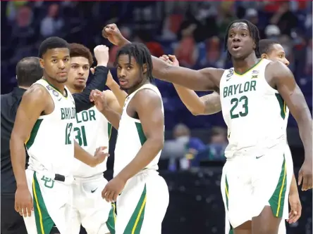  ?? JAMIE SQUIRE/GETTY IMAGES ?? Baylor’s Jared Butler (12), MaCio Teague (31) and Davion Mitchell (center) are the leaders of the best, deepest group of guards in the country. Houston found that out the hard way in a blowout loss Saturday at the Final Four in Indianapol­is.