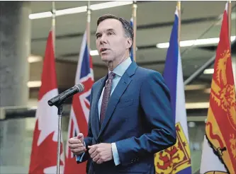  ?? PATRICK DOYLE
THE CANADIAN PRESS ?? Finance Minister Bill Morneau speaks with reporters before a meeting with provincial and territoria­l finance ministers in Ottawa on Tuesday.