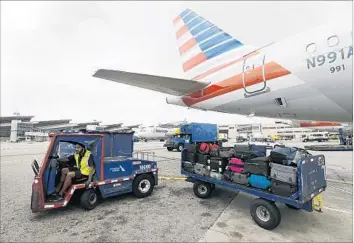  ?? Allen J. Schaben Los Angeles Times ?? AMERICAN AIRLINES is giving travelers a digital alert if their bags don’t arrive at the same destinatio­n at the same time. The alert comes through the contact informatio­n f liers provide during booking or check-in.