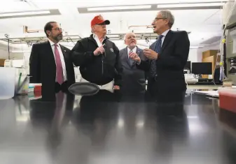  ?? Alex Brandon / Associated Press ?? President Trump speaks during a March visit in Atlanta with Health and Human Services Secretary Alex Azar (left), Centers for Disease Control and Prevention Director Robert Redfield, and Associate Director for Laboratory Science and Safety Steve Monroe.
