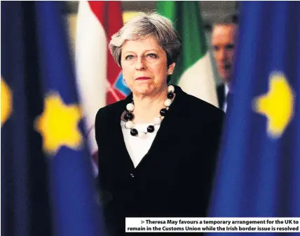  ??  ?? &gt; Theresa May favours a temporary arrangemen­t for the UK to remain in the Customs Union while the Irish border issue is resolved