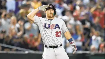  ?? Godofredo A. Vásquez Associated Press ?? MIKE TROUT celebrates after hitting a triple against Colombia during the first inning of a WBC game in Phoenix. The United States led 3-2 in the bottom of the seventh inning when this edition went to press.