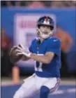  ?? JOHN BLAINE/ FOR THE TRENTONIAN ?? Giants quarterbac­k Kyle Lauletta looks for an open receiver during preseason action against the Patriots on Thursday night.