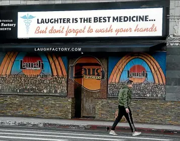  ?? AP ?? It’s no laughing matter in Los Angeles, where the mayor has ordered the closure of all bars, nightclubs, restaurant­s, gyms and entertainm­ent venues.