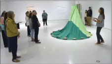  ?? ?? Artist Judy Anderson (at right) speaks during the public reception for her exhibition …Indigenize­d at the Art Gallery of Swift Current, Sept. 15.