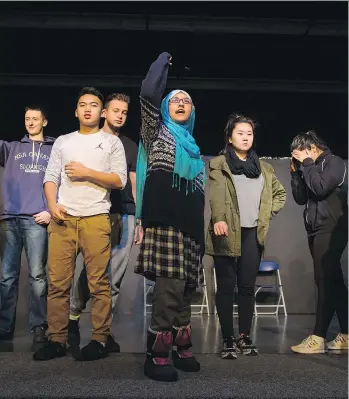  ?? RICHARD LAM ?? Umamah Mokarram, centre, and other students at Burnaby’s Byrne Creek Community School perform a play on Tuesday aimed at raising the issue of racism. The students were involved in the scriptwrit­ing, too.