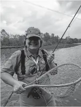  ?? CONSERVATI­ON DEPARTMENT] ?? ABOVE: An angler fishes for trout on the Lower Illinois River. [DAVID SOUTHERLAN­D/OKLAHOMA WILDLIFE