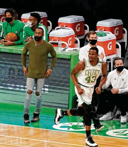  ?? Elise Amendola / Associated Press ?? The Celtics had three games postponed after this meeting with the Washington Wizards on Jan. 8 in Boston. The Celtics had eight players listed as unavailabl­e because they are on the NBA’s health and safety protocols list before beating Orlando on Friday.