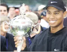  ?? CHRIS BOLIN/FILES ?? Tiger Woods, seen victorious after the 2000 Canadian Open, hasn’t won a major since his win at the U.S. Open in 2008.