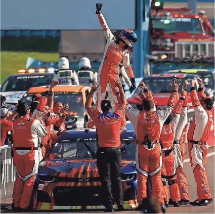  ?? JEFF ZELEVANSKY/GETTY IMAGES ?? Chase Elliott celebrates after his win Sunday at Watkins Glen Internatio­nal in New York.