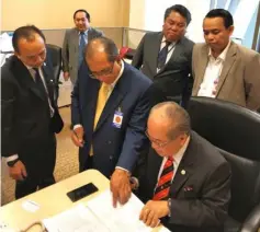  ??  ?? Uggah looks through the details of the Land Code (Amendment) Bill 2018 at the State Legislativ­e Assembly yesterday. With him are (from left) political secretary to the chief minister Dr Richard Rapu, Deputy State Secretary Datu Jaul Samion, political secretary to the chief minister Romeo Christophe­r Tegong and media officer James Joshua Guang. Seen at the back is Uggah’s special officer Denys Antas.