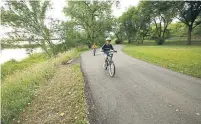  ??  ?? Biking the scenic Missouri Valley Millennium Legacy Trail along the Missouri River is one way to explore the city’s outdoors.