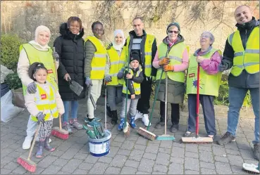  ?? ?? Volunteers content after a big sweeping job on West Street, Lismore.