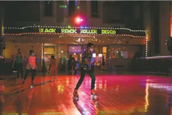  ?? Photos by Marissa Leshnov / Special to The Chronicle ?? Skaters enjoy the roller disco at the reopened Church of 8 Wheels on Saturday, but by Tuesday the venue was closed again for pandemic safety.