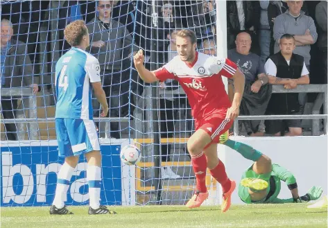  ??  ?? RICHARD PENIKET watches his 35th minute goal fly in past Chester keeper Freddy Hall.Picture by Chester Chronicle.