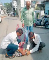  ??  ?? People arrange crackers to celebrate the raid on police official D. Durga Prasad’s house on Wednesday. —