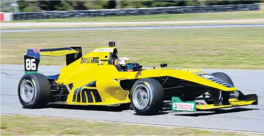  ?? PHOTO: GEOFF RIDDER. ?? Newgenerat­ion Toyota . . . Brendon Leitch, of Invercargi­ll, practises for the opening round of the Toyota Racing Series, at Highlands Motorsport Park, in the Toyotapowe­red Tatuus FT50 single seater that all the drivers will pilot.