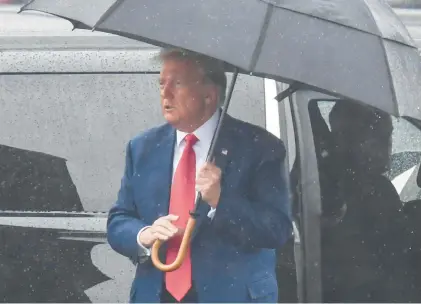  ?? OLIVIER DOULIERY/GETTY-AFP ?? Former President Donald Trump arrives to Ronald Reagan Washington National Airport in Arlington, Virginia, on Aug. 3 after his arraignmen­t in court.